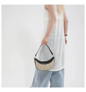 Chic straw crescent shoulder bag with PU leather trim, perfect for beach resort and casual daily wear.