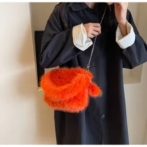 Vibrant orange plush chain shoulder bag for women, stylish furry handbag for autumn style.