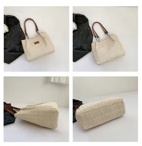 Woven straw tote bag for women, summer beach shoulder bag with brown leather handles.