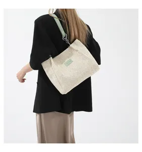 Woven straw tote bag for women, summer beach shoulder bag with contrast color strap.