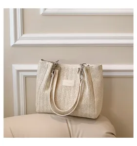 Beige woven straw tote bag for women, stylish casual summer beach vacation shoulder bag.