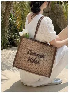 Woven straw tote bag for women, large capacity beach shoulder bag with stylish embroidery.