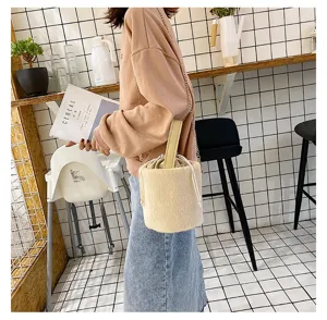 Autumn winter fluffy bucket shoulder bag with chain strap and top handle cozy style.