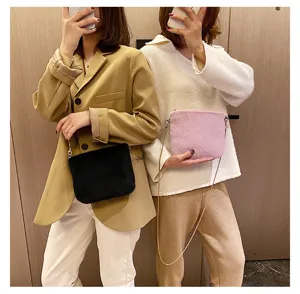 Detail view showing plush crossbody bags with chain straps in black and purple colors worn by models.