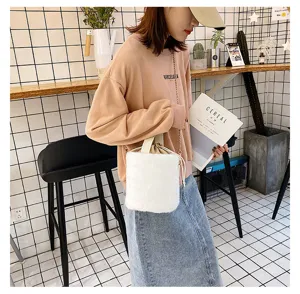 White plush bucket bag for women, cute furry shoulder bag with chain strap and drawstring.