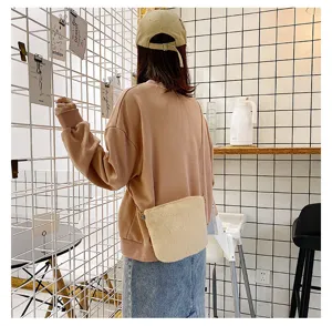 Cute fluffy crossbody bag for women, soft plush shoulder bag with chain strap, stylish winter purse.