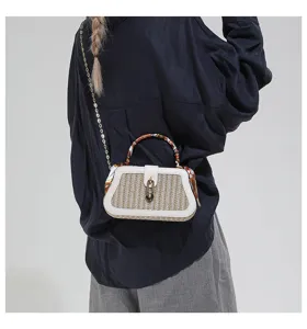 Stylish straw woven handbag with white leather trim, chain strap and scarf. Perfect daily bag.