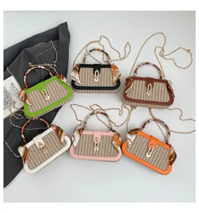 Stylish straw woven mini handbag with twilly scarf handle, chic crossbody box bag.