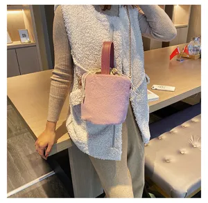 Stylish plush bucket bag with top handle and chain strap, soft autumn winter handbag for women.