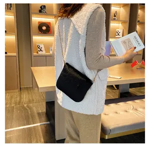 Black plush crossbody bag with chain strap, cozy fuzzy shoulder handbag for women autumn winter