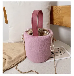 Cozy plush bucket bag with shoulder chain strap, soft faux fur handbag for autumn and winter.