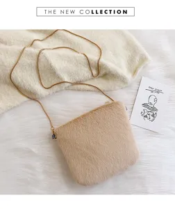 Detail view of the soft plush crossbody bag with chain strap, cozy autumn winter design.