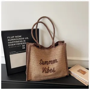 Woven straw tote bag for women, large capacity casual shoulder bag with brown trim beach style.