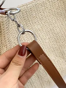 Summer beach woven straw shoulder bucket tote bag with leather strap and metal ring details.