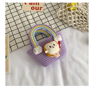 Cute purple woven bucket bag with rainbow handle and plush toast doll pendant for daily use.
