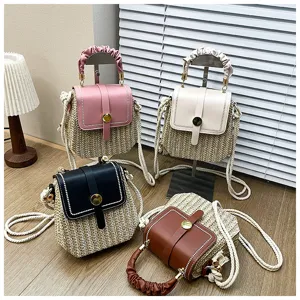 Woven straw crossbody box bag detail showcasing multi-color options with braided handles and rope straps.
