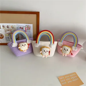 Cute rainbow woven bucket bag with kawaii toast plush charm and tassel for daily sweet style.