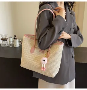 Stylish straw woven tote bag for women, large capacity shoulder bag with pink trim.