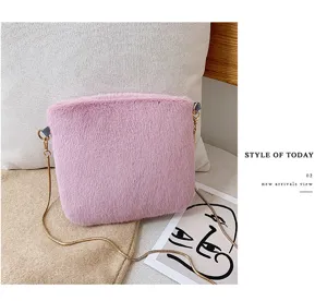Pink plush shoulder bag detail, soft faux fur texture with elegant gold chain strap view.
