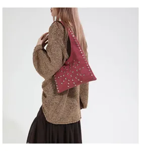 Details view of stylish studded hobo shoulder bag, casual fashion handbag for women daily wear.