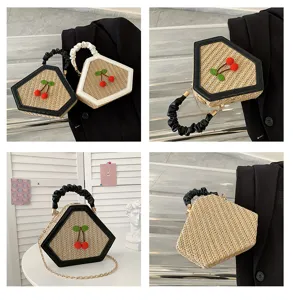 Rhombus straw woven handbag featuring ruffle handle and cute cherry decor for women.