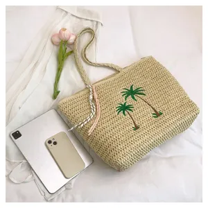 Japanese style hand-woven straw beach tote bag with cute palm tree embroidery design for summer.
