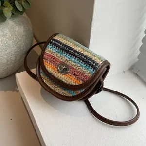 Mini woven crossbody bag for women, stylish color block shoulder bag with leather trim.