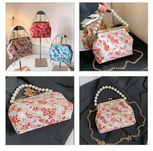 Pearl handle kiss-lock floral handbag detail, elegant evening cross-body bag showcase