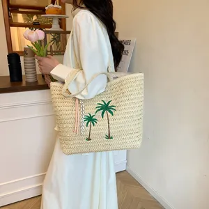 Japanese handmade woven straw tote bag with palm tree embroidery for women beach holiday use.