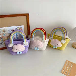 Cute mini woven bucket bag with colorful rainbow handle and fluffy plush cloud cartoon design.