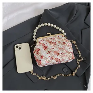 Floral kiss-lock handbag with pearl handle and chain strap, elegant retro shoulder bag.
