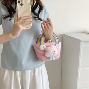 Sweet mini woven bucket bag with rainbow handles and cute plush cloud pendant for women.