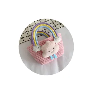 Sweet mini woven plush cloud bucket bag with colorful rainbow handle open basket style main.