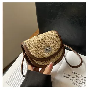 Mini woven leather trim shoulder bag with elegant metal turn lock closure detail view.