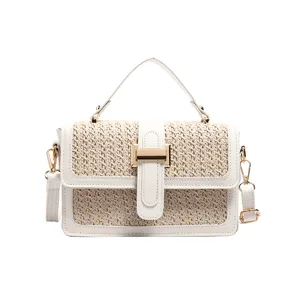 Stylish women woven straw handbag with top handle and flap closure for summer vacation daily use.