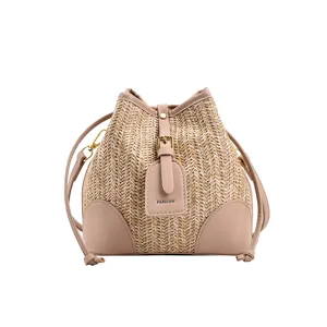 Summer new women's woven straw bucket bag, stylish single shoulder bag with drawstring closure.