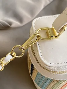 Summer straw woven box handbag featuring metal chain strap and hardware hook detail display