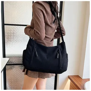 Casual black corduroy shoulder bag for women, large capacity daily commuter crossbody tote.
