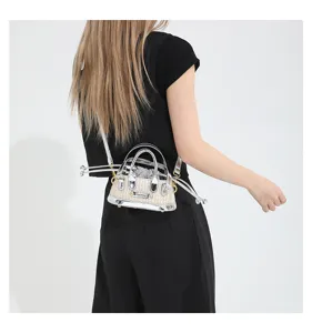 Mini straw woven metallic crossbody shoulder bag with top handle and drawstring inner lining.