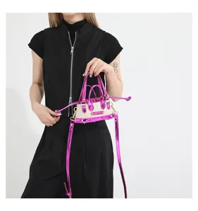 Cute mini straw crossbody bag with metallic pink leather trim and dual handles for summer.