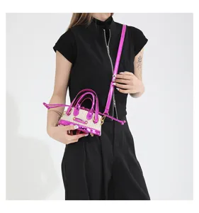 Niche design mini straw crossbody bag with metallic pink trim, stylish summer handbag.