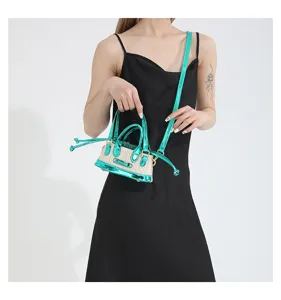 Detailed view of the stylish green woven mini crossbody bag, featuring a chic contrast design.