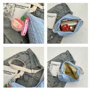 Detailed view of the blue quilted puffer shoulder bag showing interior capacity and straps.