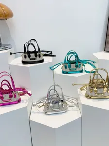 Trendy straw woven mini handbag with metallic trim, cute crossbody shoulder bag for summer.