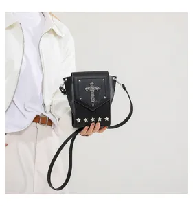 Trendy black leather crossbody bag featuring gothic cross and star studs for chic style