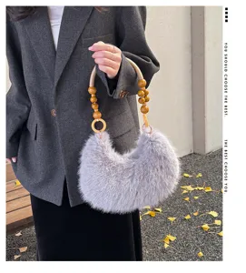 Detailed view of the fuzzy plush crescent shoulder bag with unique wooden bead handle design.