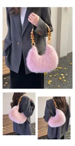 Pink plush crescent shoulder bag with wooden bead handle, stylish winter fluffy handbag detail.