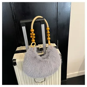 Grey plush shoulder bag with wooden bead handle, fluffy winter fashion handbag for women.