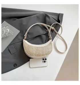 Chic crescent straw shoulder bag detail, stylish woven texture and PU leather trim for daily wear.