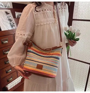 Details of the stylish color-block woven bucket bag, casual chic design for daily wear.